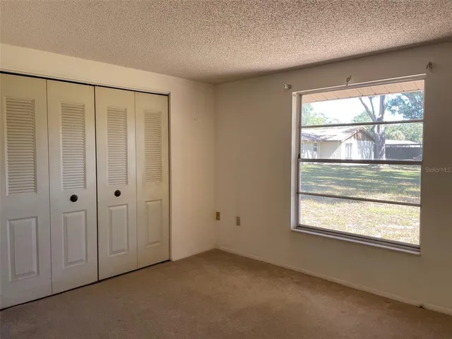 a view of a room that has a large window