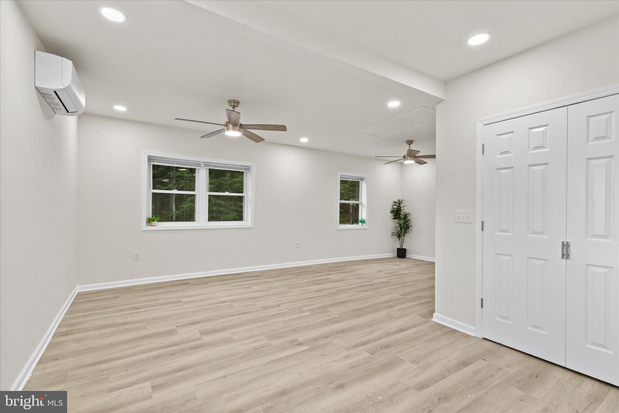 11477 Pine Pole Road Princess Anne, MD 21853 - Photo 9 of 33 Primary Bedroom with Large Closets & Sitting Area