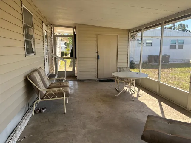 a view of a livingroom with furniture and a window