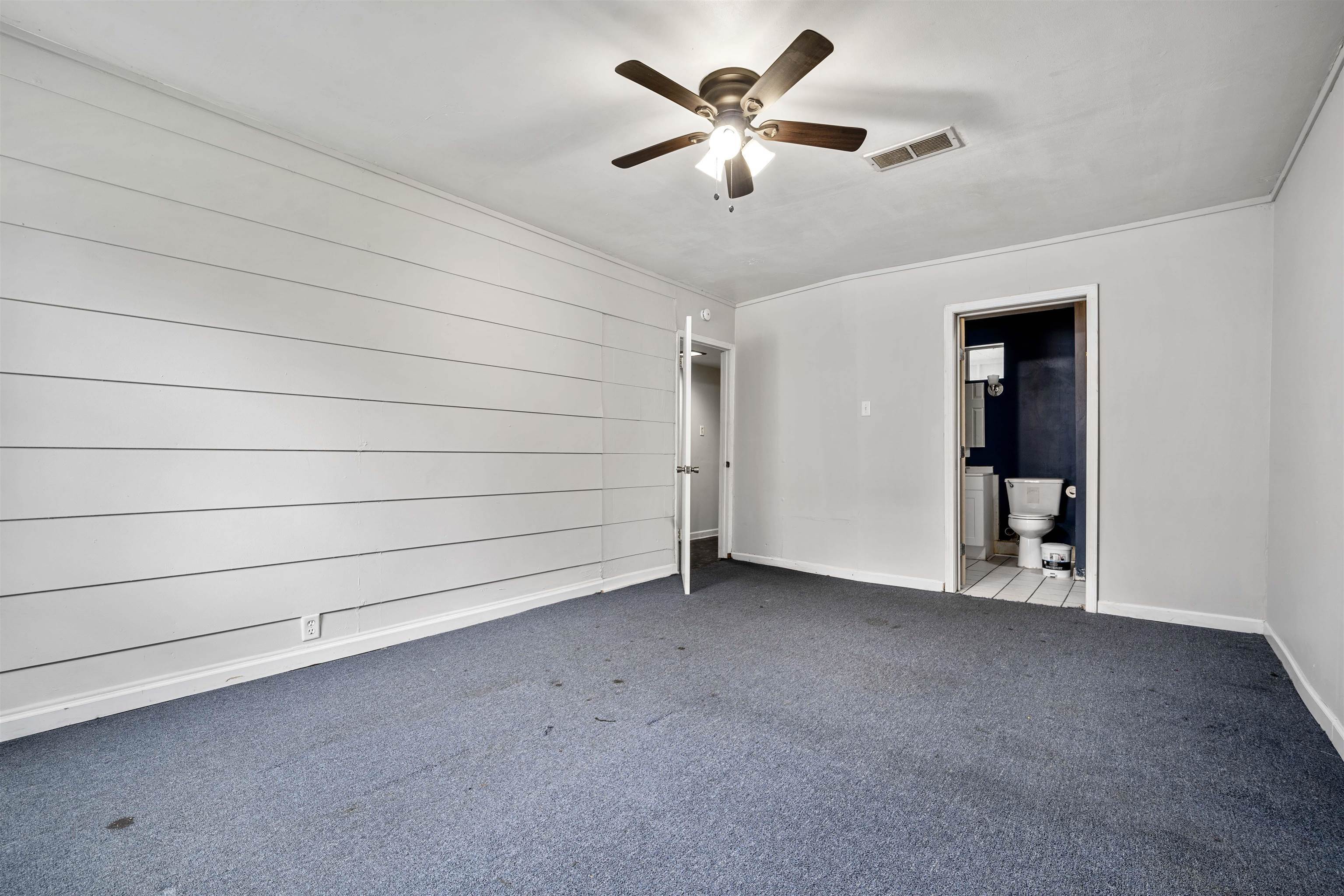 3014 Farcott Street Mobile, AL 36606 - Photo 13 of 26 Empty room featuring carpet flooring, a ceiling fan, and ornamental molding