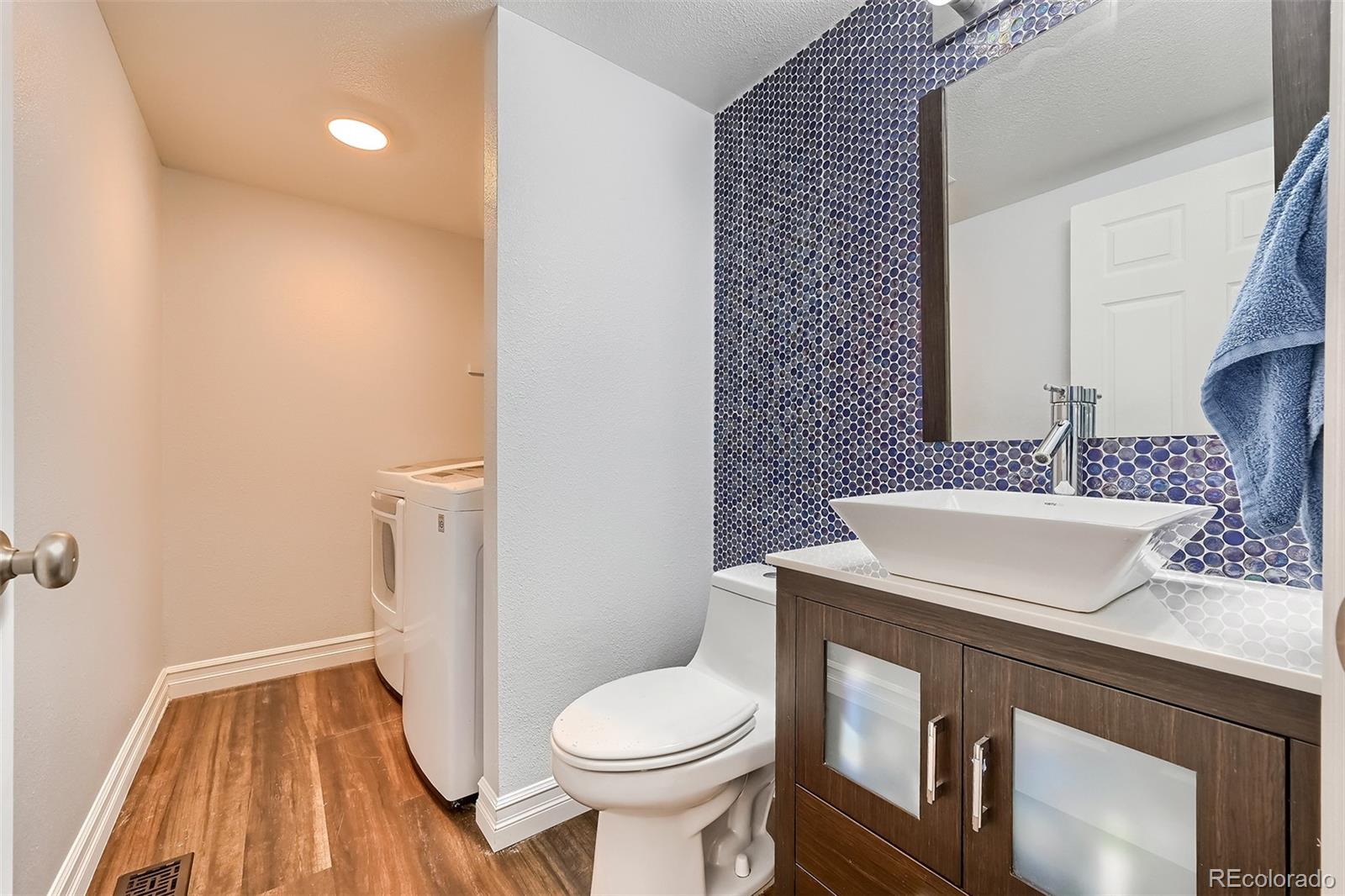 1076 Timbervale Trail Highlands Ranch, CO 80129 - Photo 12 of 29 a bathroom with a sink toilet and shower