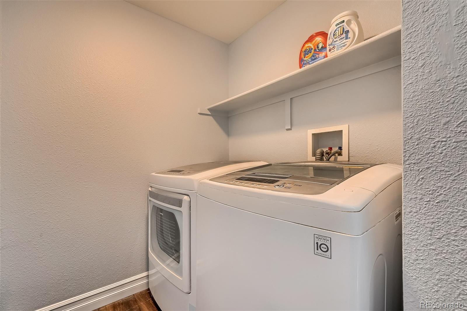 1076 Timbervale Trail Highlands Ranch, CO 80129 - Photo 13 of 29 a utility room with dryer and washer
