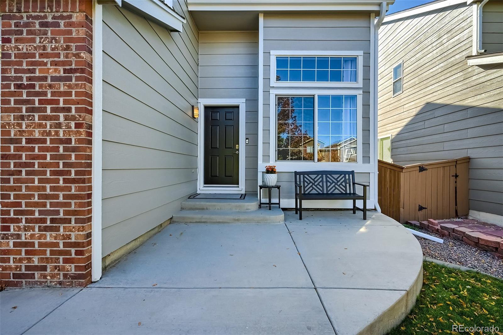 1076 Timbervale Trail Highlands Ranch, CO 80129 - Photo 2 of 29 a view of a house with backyard and porch