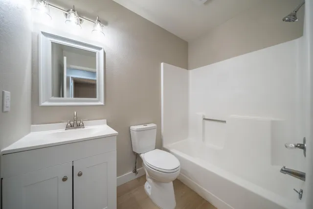 a bathroom with a toilet a sink and a bathtub