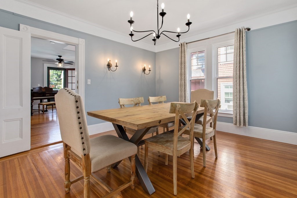28 Wave Street, Unit 2 Lynn, MA 01902 - Photo 15 of 36 a view of a dining room with furniture and wooden floor