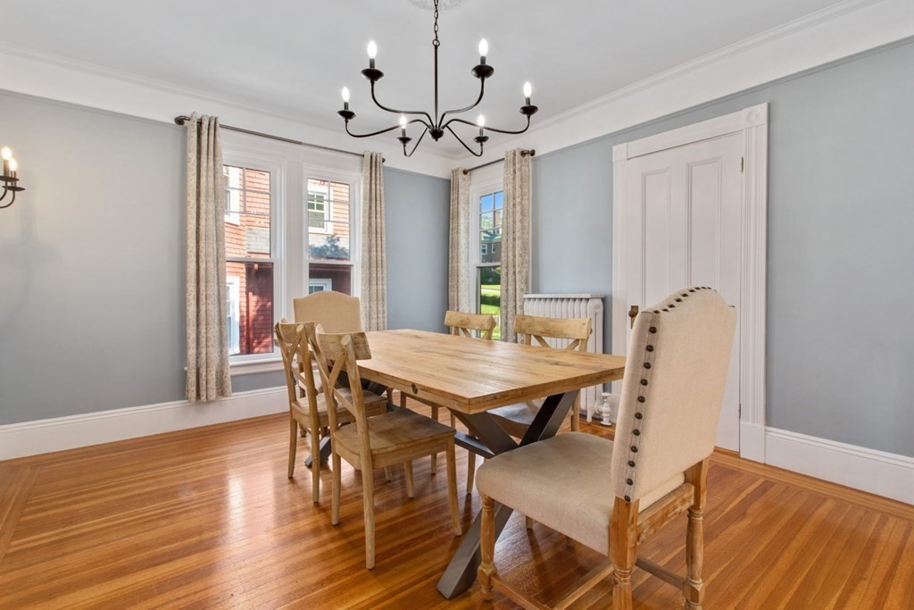 28 Wave Street, Unit 2 Lynn, MA 01902 - Photo 17 of 36 a view of a dining room with furniture window and wooden floor