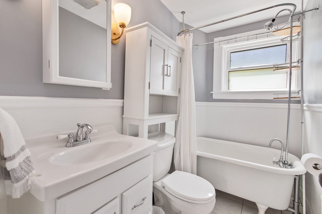 28 Wave Street, Unit 2 Lynn, MA 01902 - Photo 20 of 36 a bathroom with a sink toilet vanity and shower