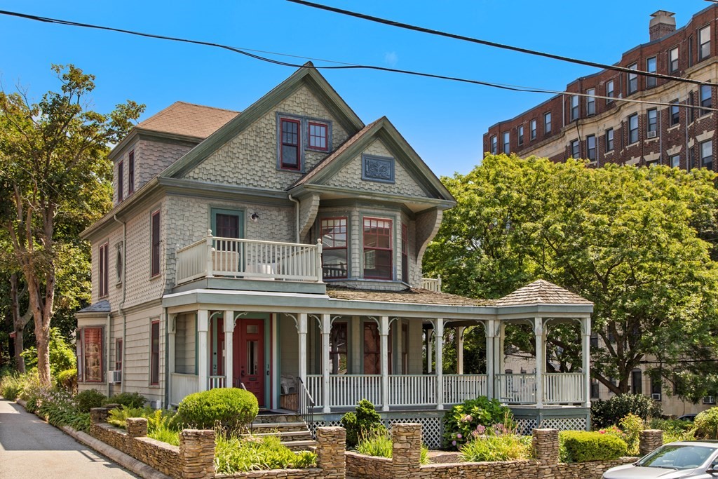 28 Wave Street, Unit 2 Lynn, MA 01902 - Photo 2 of 36 front view of a house with a small yard