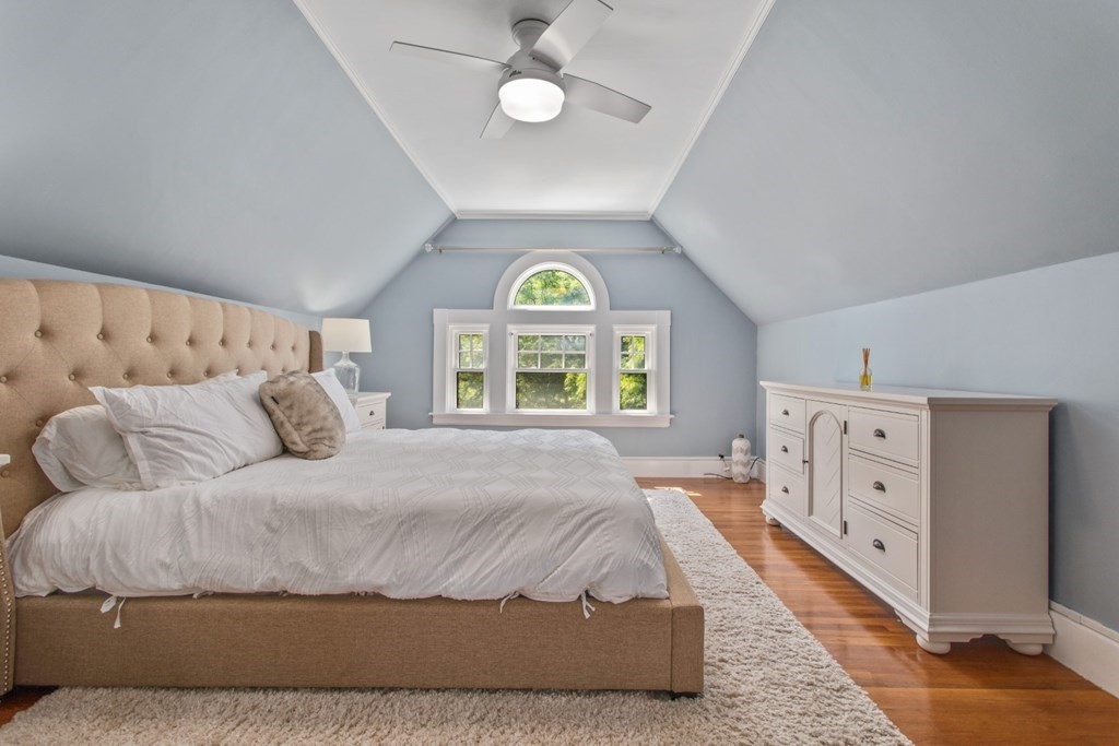 28 Wave Street, Unit 2 Lynn, MA 01902 - Photo 22 of 36 a spacious bedroom with a bed and a large window