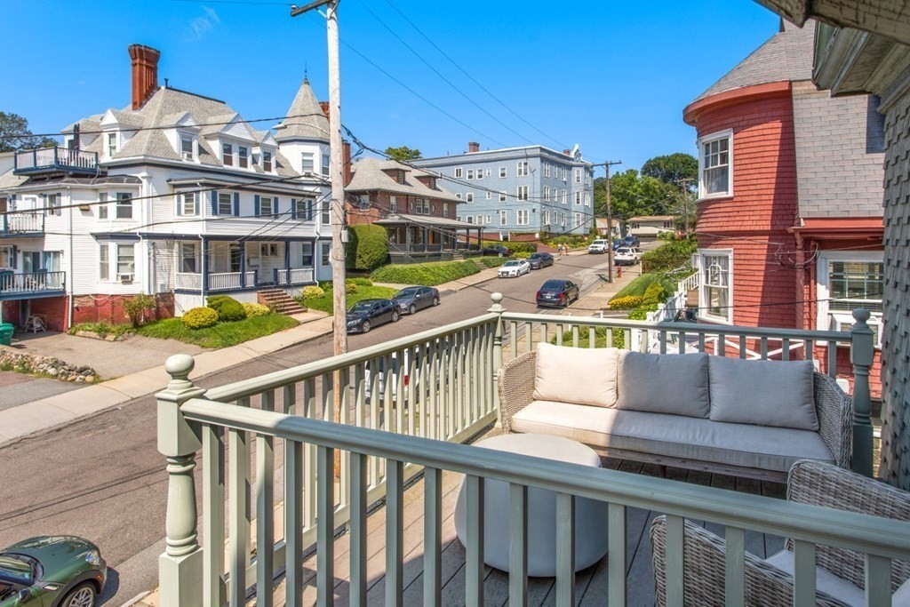 28 Wave Street, Unit 2 Lynn, MA 01902 - Photo 30 of 36 a view of a balcony with two couches and pool