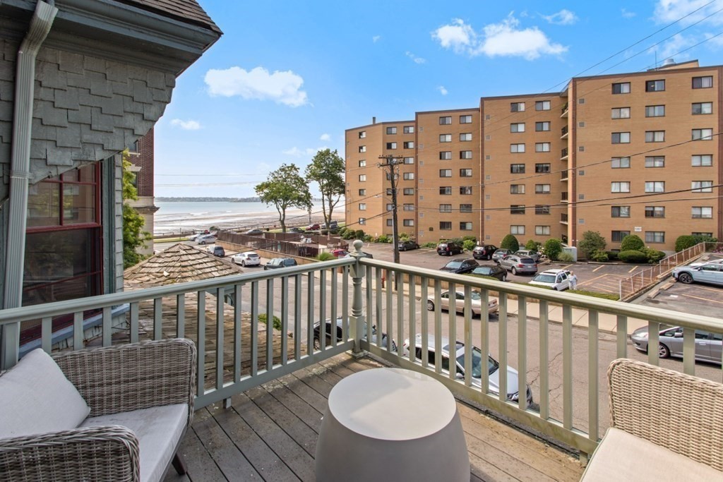 28 Wave Street, Unit 2 Lynn, MA 01902 - Photo 31 of 36 a view of a balcony with wooden floor