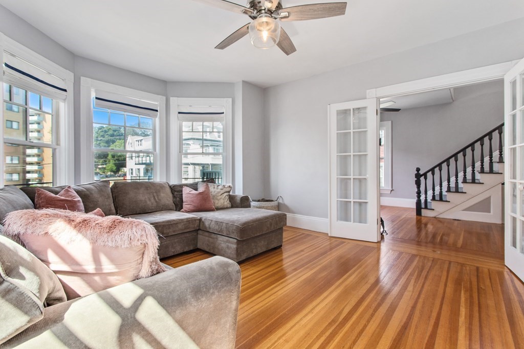 28 Wave Street, Unit 2 Lynn, MA 01902 - Photo 7 of 36 a living room with furniture and a wooden floor