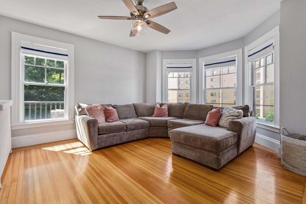 28 Wave Street, Unit 2 Lynn, MA 01902 - Photo 8 of 36 a living room with furniture and a window