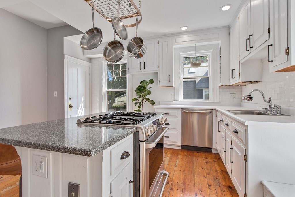 28 Wave Street, Unit 2 Lynn, MA 01902 - Photo 9 of 36 a kitchen with stainless steel appliances granite countertop a stove and a sink