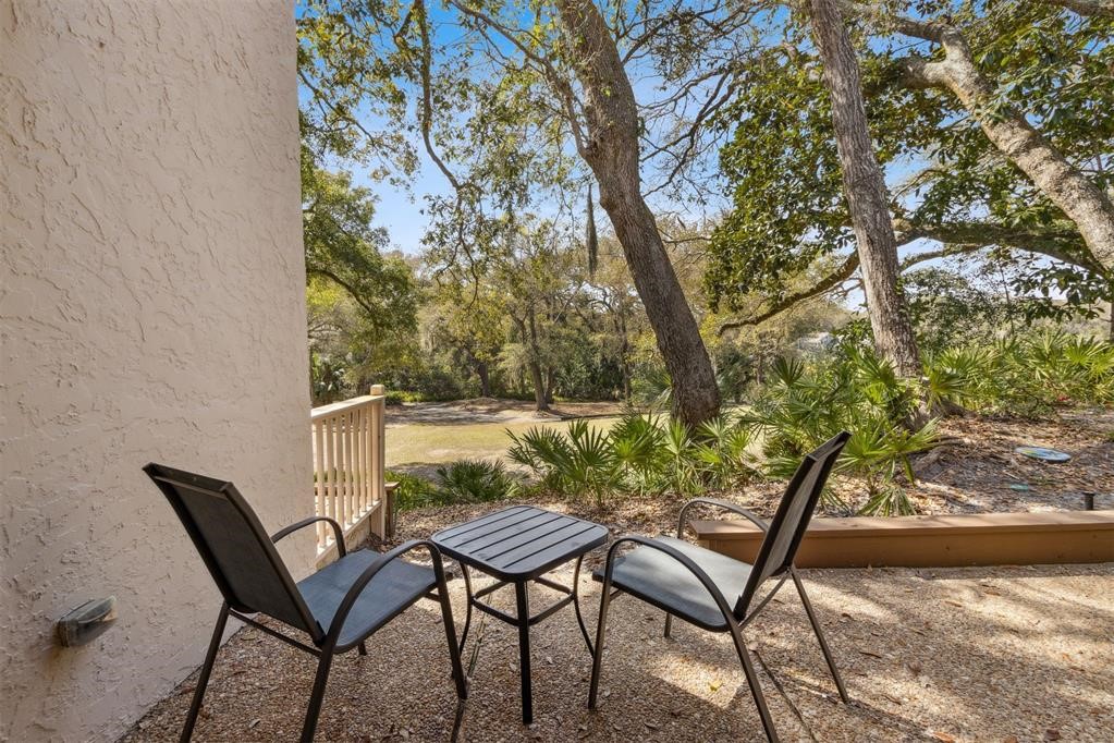 2004 Beachwood Road, Unit 2004 Fernandina Beach, FL 32034 - Photo 13 of 54 a view of a chairs and table in the patio