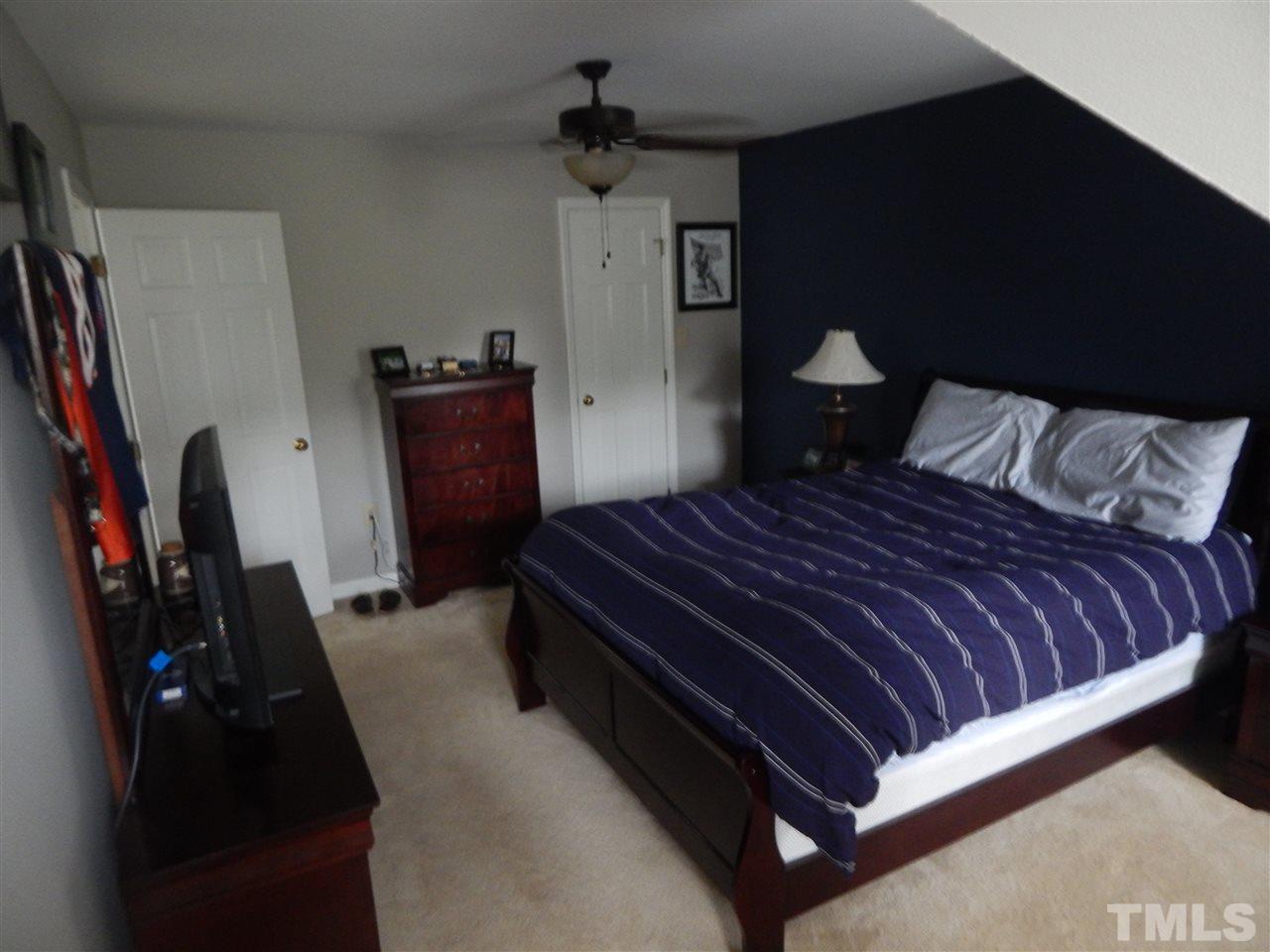 910 Albany Court Raleigh, NC 27615 - Photo 12 of 14 a bedroom with a bed and a closet