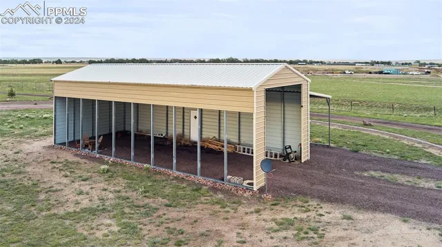 a backyard of a house with wooden fence