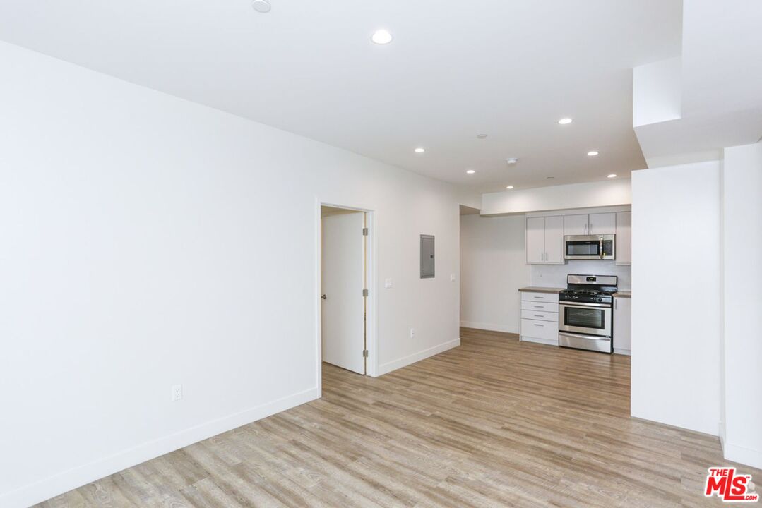 744 Hartford Avenue, Unit 301 Los Angeles, CA 90017 - Photo 2 of 15 a view of kitchen and wooden floor