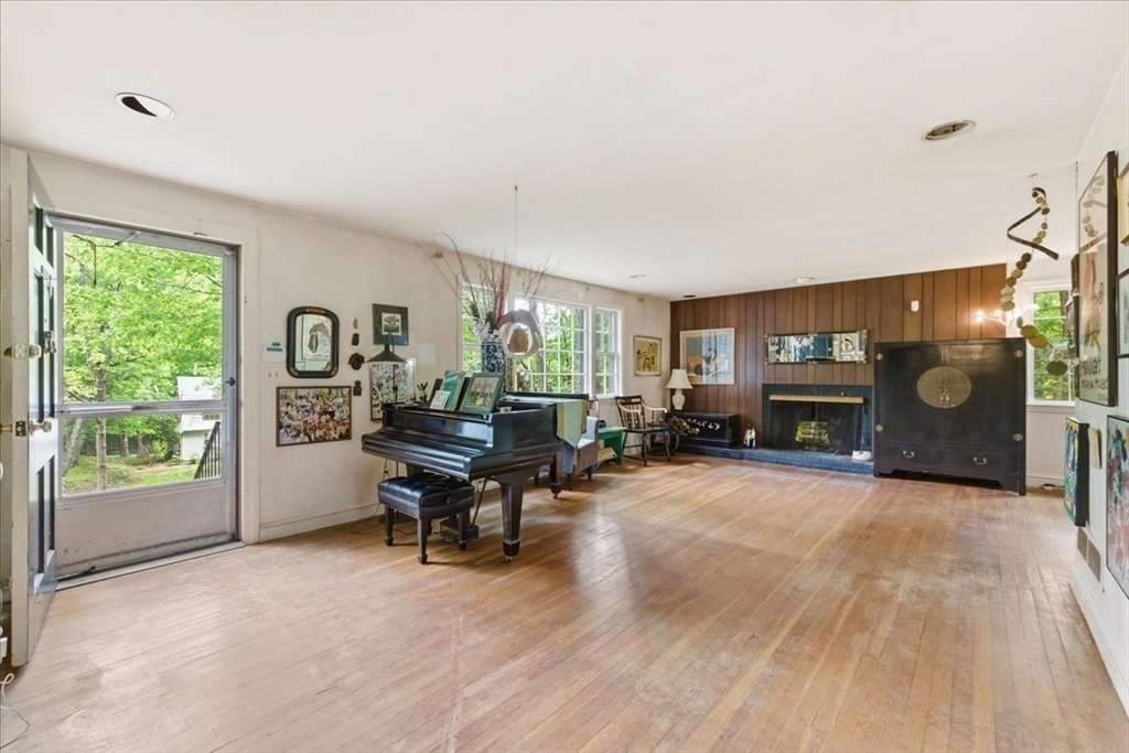 99 Brook Road Sharon, MA 02067 - Photo 3 of 37 a living room with furniture and a fireplace
