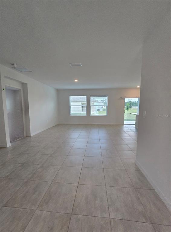 1373 Addison Blf Lane Kissimmee, FL 34744 - Photo 7 of 15 a view of an empty room with a window