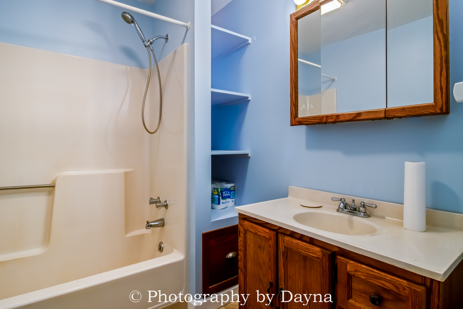 1501 South 7th Avenue Kankakee, IL 60901 - Photo 11 of 19 a bathroom with a sink and a mirror