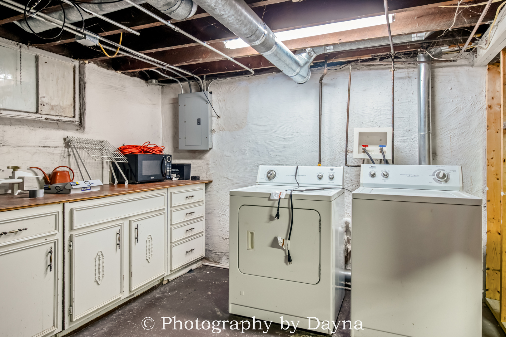 1501 South 7th Avenue Kankakee, IL 60901 - Photo 14 of 19 a utility room with cabinets washer and dryer