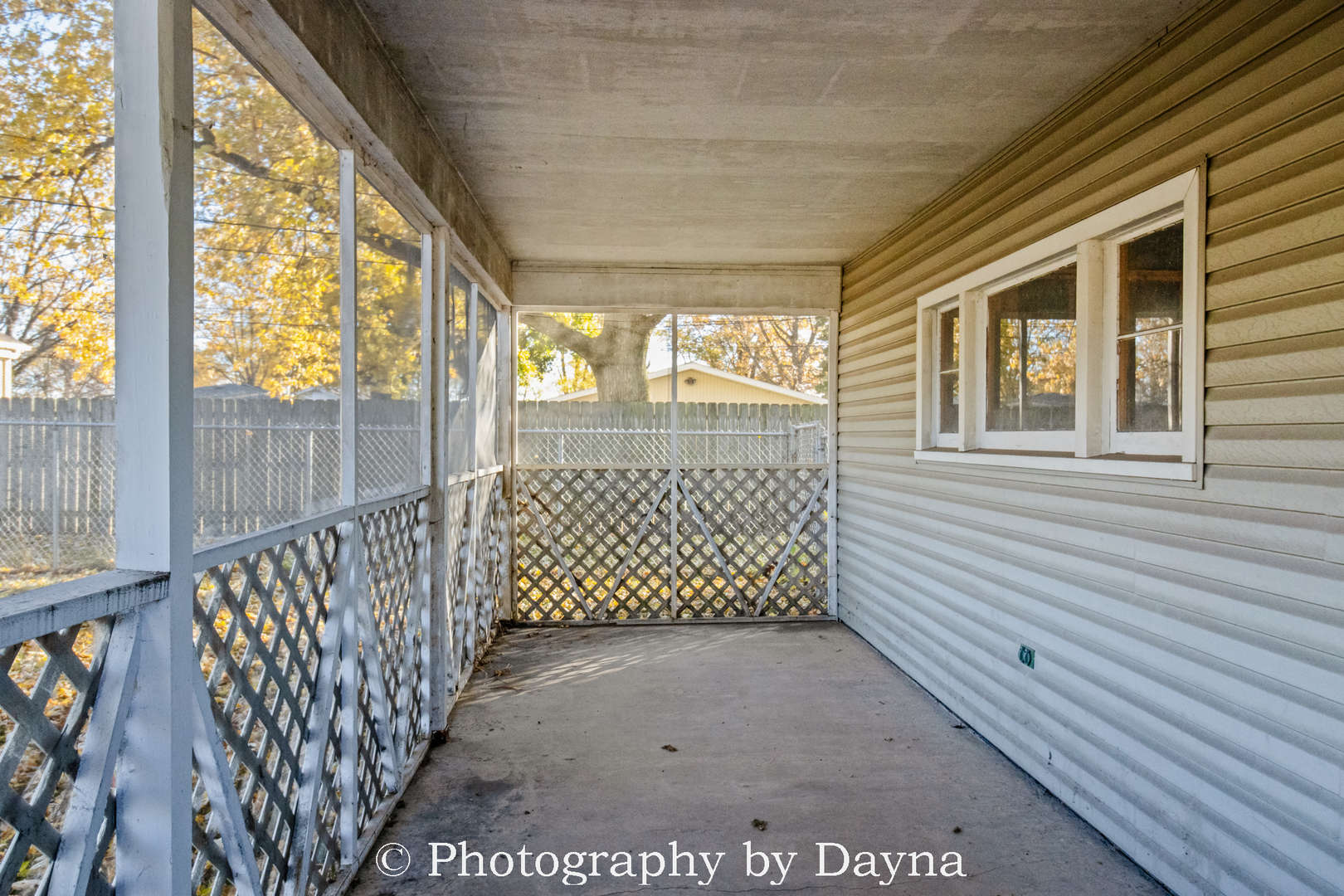 1501 South 7th Avenue Kankakee, IL 60901 - Photo 18 of 19 a view of a porch with wooden floor and iron stairs