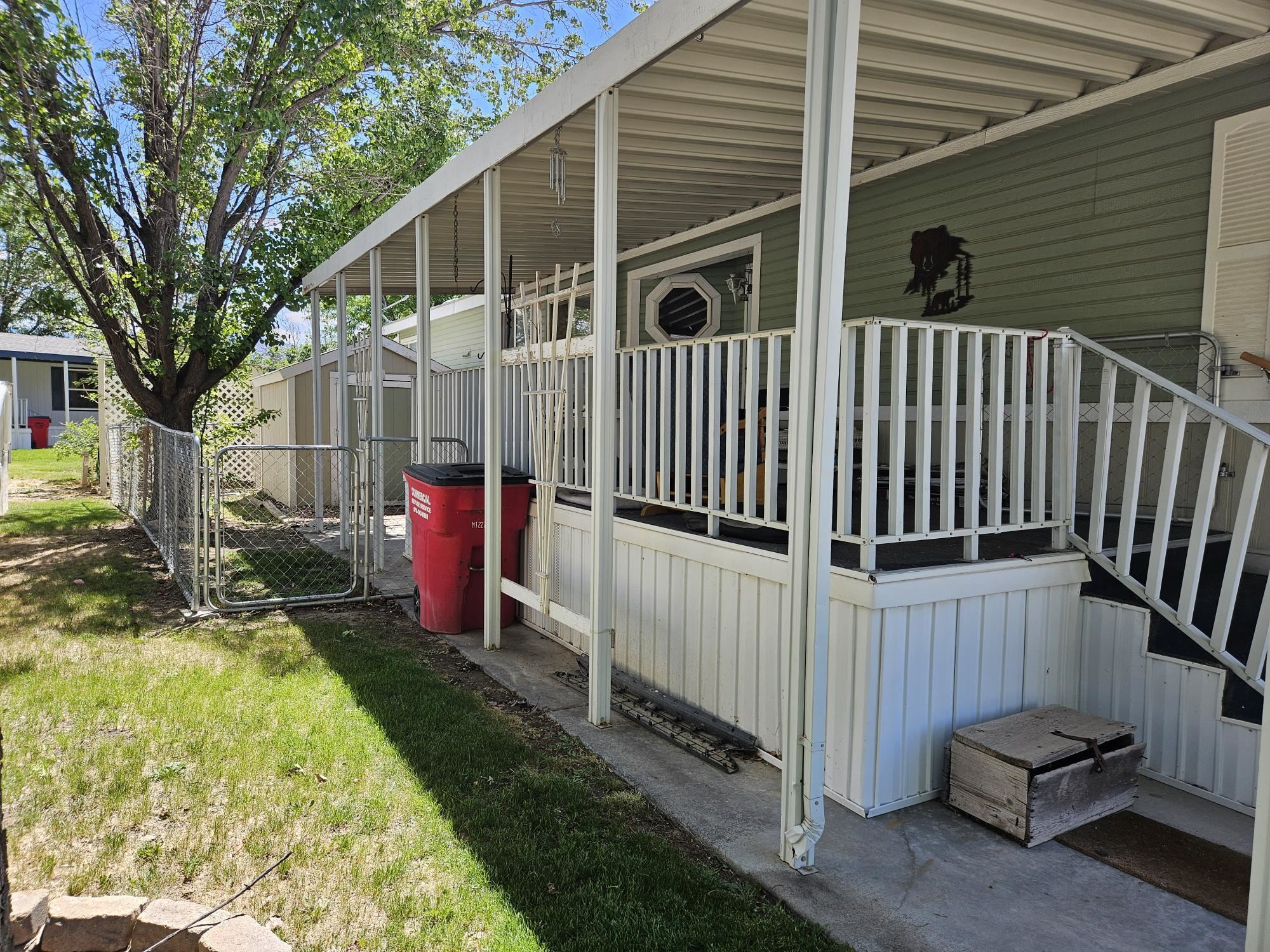 435 32 Road, Unit 424 Clifton, CO 81520 - Photo 5 of 21 a view of a backyard with a small cabin and furniture