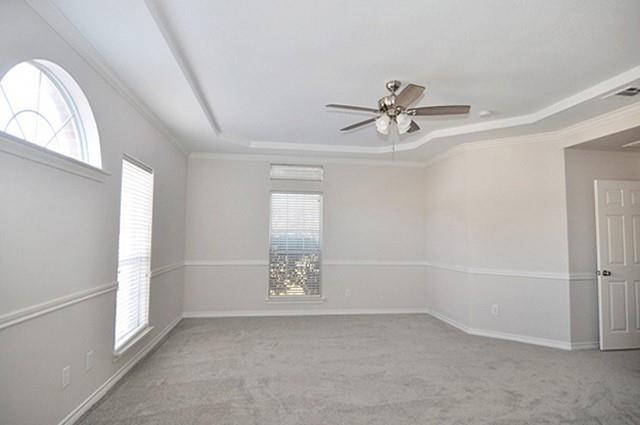 521 Mustang Ridge Drive Murphy, TX 75094 - Photo 15 of 31 an empty room with windows and fan