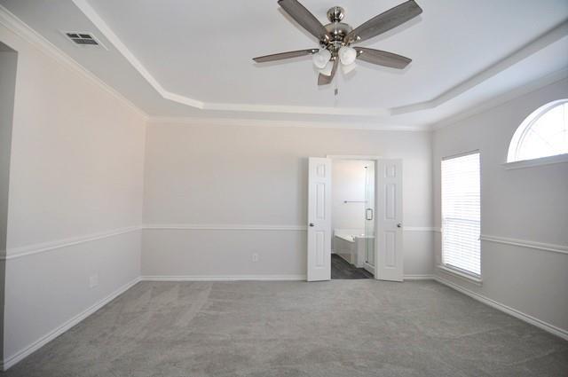 521 Mustang Ridge Drive Murphy, TX 75094 - Photo 16 of 31 an empty room with chandelier fan and windows