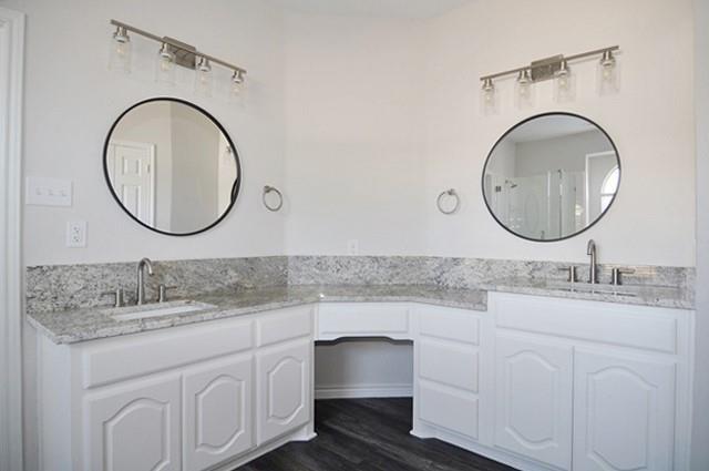 521 Mustang Ridge Drive Murphy, TX 75094 - Photo 18 of 31 a bathroom with a sink and a mirror