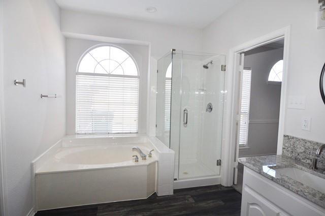 521 Mustang Ridge Drive Murphy, TX 75094 - Photo 19 of 31 a bathroom with a granite countertop tub sink and shower