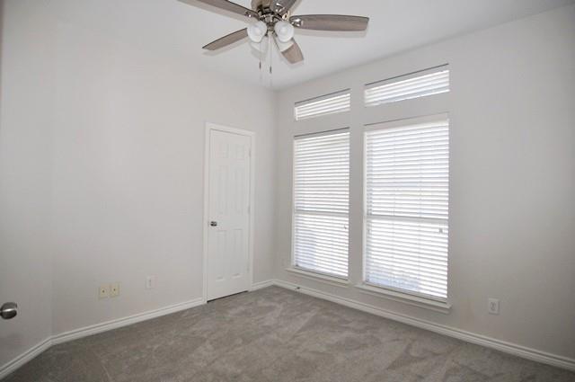 521 Mustang Ridge Drive Murphy, TX 75094 - Photo 22 of 31 an empty room with windows and fan