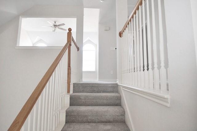 521 Mustang Ridge Drive Murphy, TX 75094 - Photo 24 of 31 a view of staircase with white walls and windows