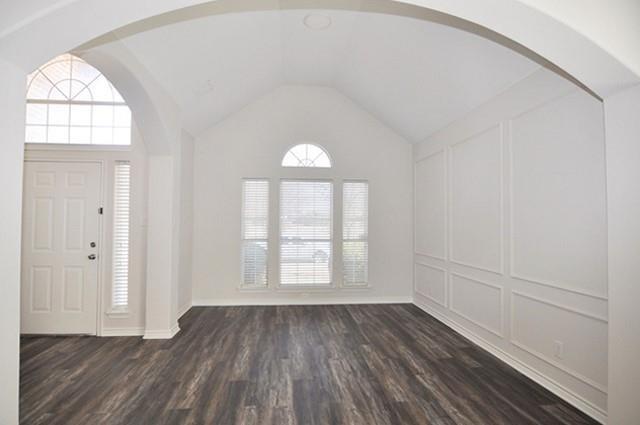 521 Mustang Ridge Drive Murphy, TX 75094 - Photo 5 of 31 an empty room with wooden floor cabinet and windows