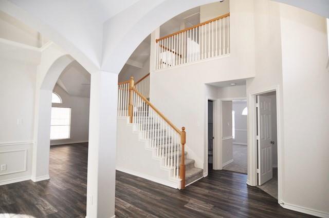 521 Mustang Ridge Drive Murphy, TX 75094 - Photo 7 of 31 a view of a hallway with wooden floor and stairs