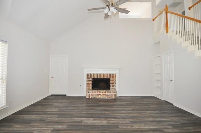 521 Mustang Ridge Drive Murphy, TX 75094 - Photo 8 of 31 a view of an empty room with wooden floor and a window