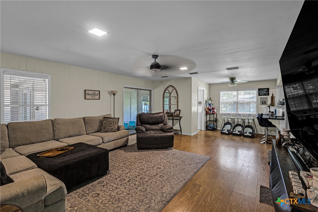 1604 North Cleveland Avenue Cameron, TX 76520 - Photo 13 of 46 a living room with furniture a flat screen tv and a large window