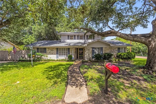 a front view of a house with swimming pool