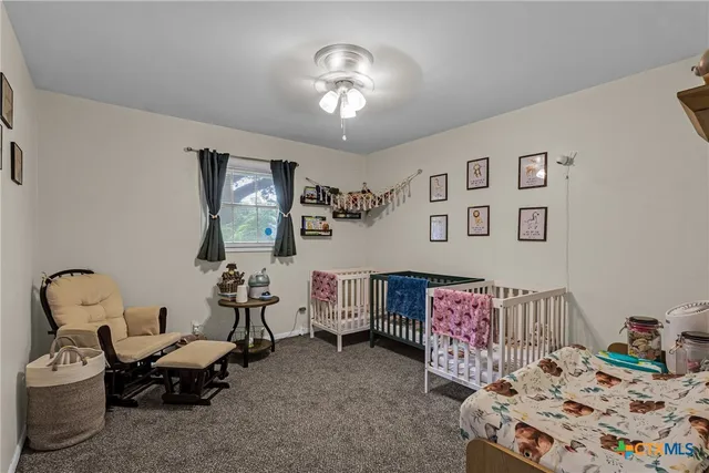 a bedroom with furniture and a chandelier