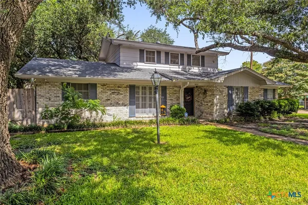 a house view with a garden space