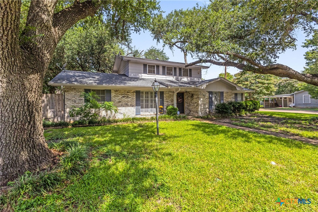 1604 North Cleveland Avenue Cameron, TX 76520 - Photo 4 of 46 a front view of a house with a yard table and chairs