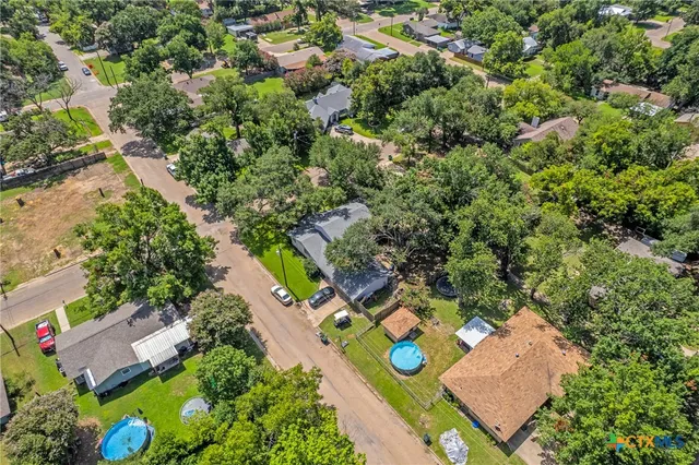 an aerial view of residential house with outdoor space
