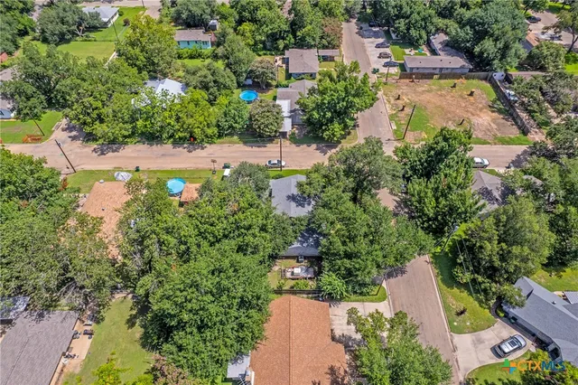 an aerial view of a house with a garden