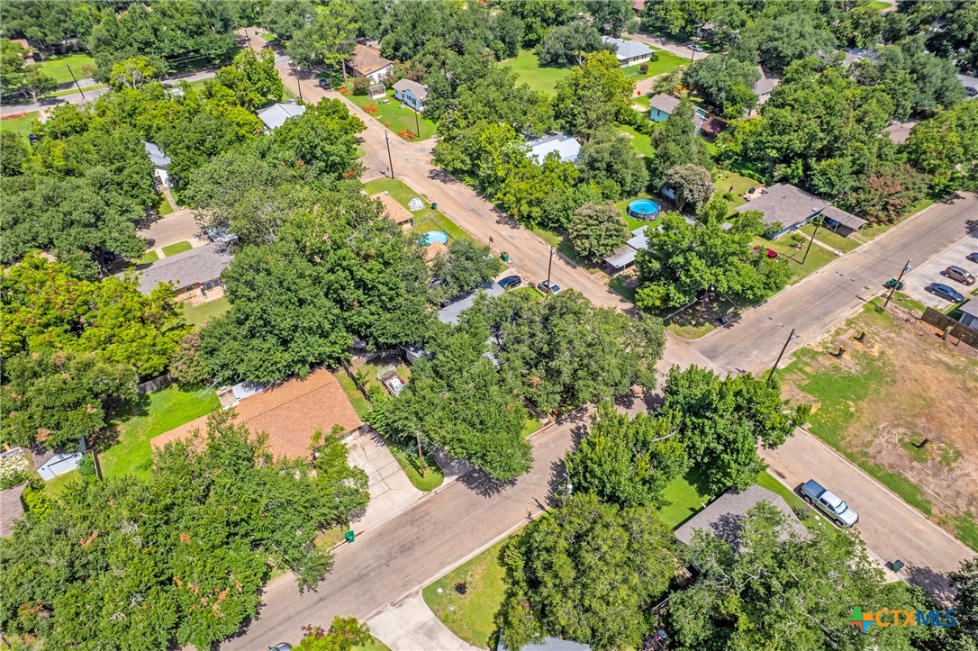 1604 North Cleveland Avenue Cameron, TX 76520 - Photo 43 of 46 an aerial view of residential house with outdoor space and trees all around