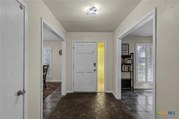 a view of entryway with wooden floor