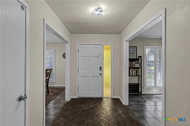 a view of entryway with wooden floor