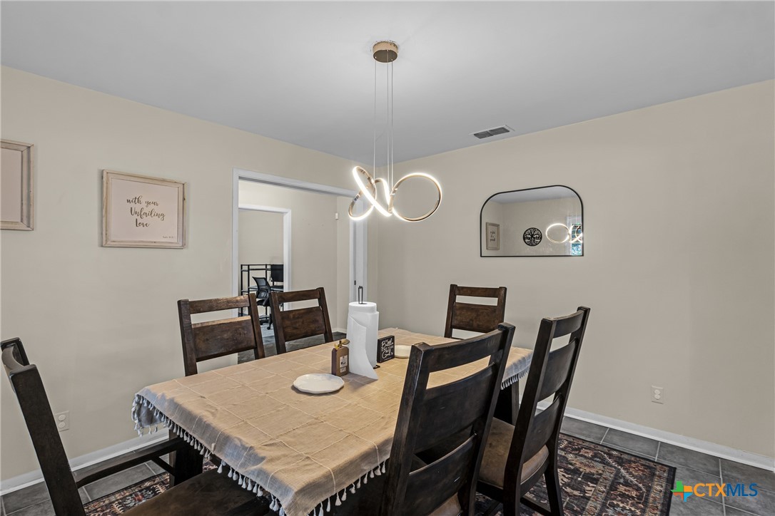 1604 North Cleveland Avenue Cameron, TX 76520 - Photo 10 of 46 a view of a dining room with furniture