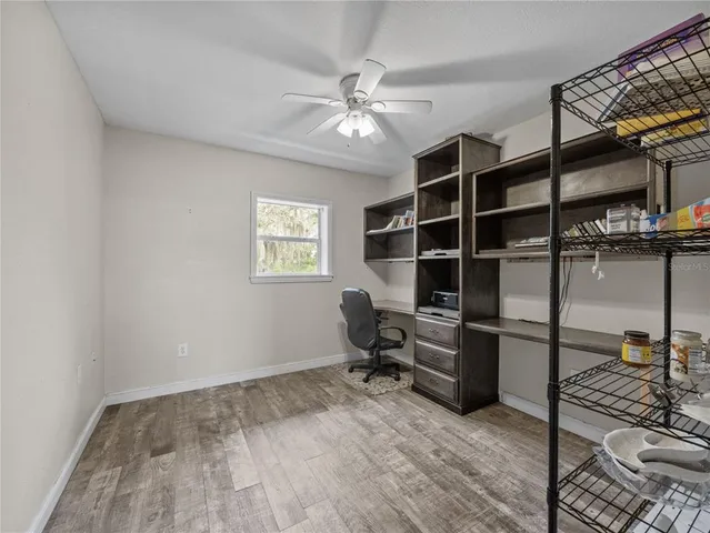 a view of a workspace with furniture