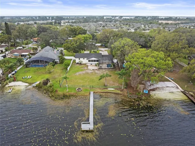 an aerial view of a houses with a street